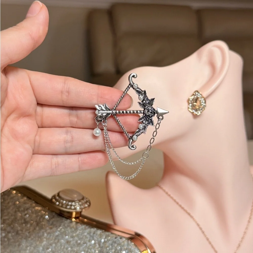 Elegant Silver Bow and Arrow Brooch